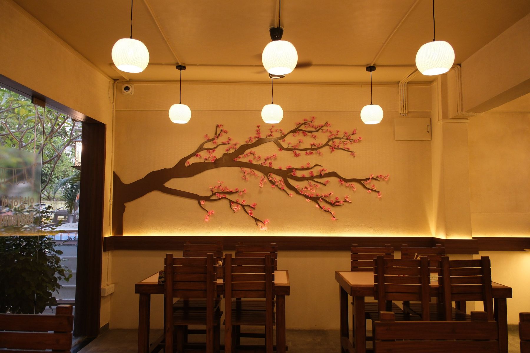 Custom 3D-printed pendants over the dining tables