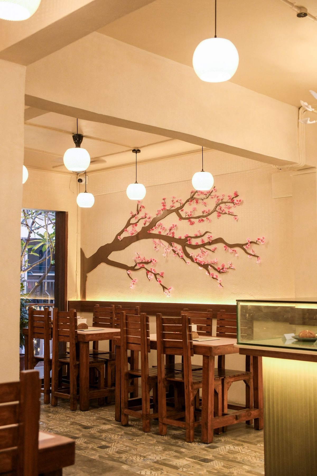 The finished dining room with the cherry blossom wall and pendants