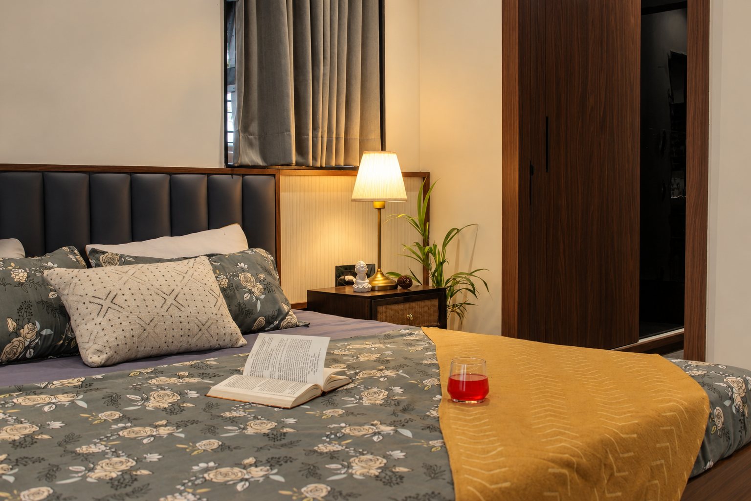 Master bedroom with an upholstered headboard set in walnut, photo